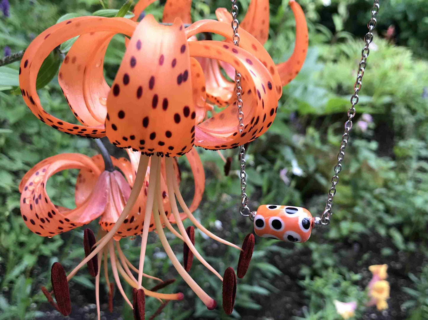 14-inch necklace with bright orange glass cylinder, black and white dots (Murano-style glass handmade in Montreal), stainless steel chain