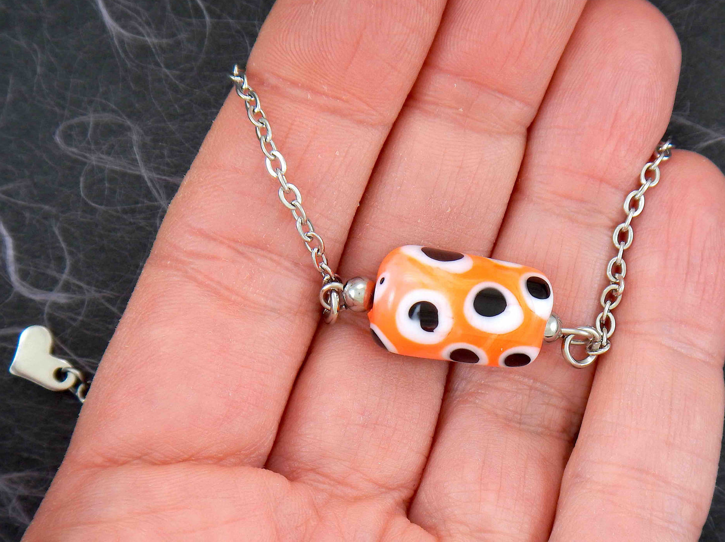 14-inch necklace with bright orange glass cylinder, black and white dots (Murano-style glass handmade in Montreal), stainless steel chain