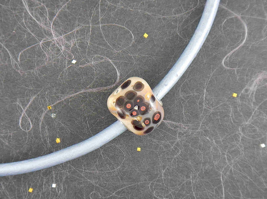 Choker necklace with off-white cylinder glass bead (Murano-style glass handmade in Montreal), black and orange dots, baby blue leather cord, stainless steel clasp