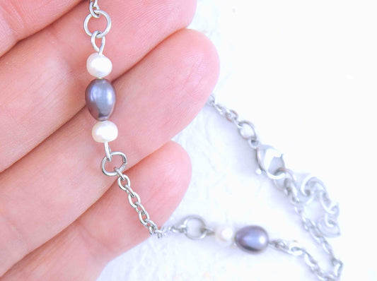 Anklet with iridescent violet and white natural freshwater pearls on stainless steel chain