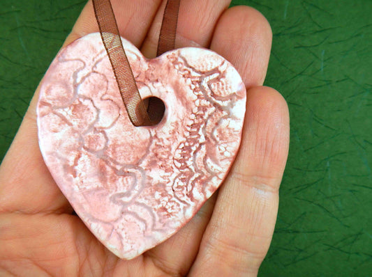 Ornament with large light pink ceramics heart handmade in Montreal, burgundy lace pattern, chocolate brown organza ribbon