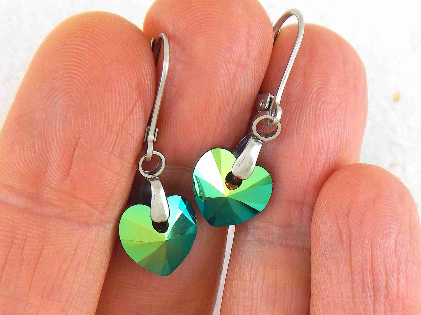 Short earrings with 10mm faceted Scarabeus Green Swarovski crystal hearts, stainless steel lever back hooks