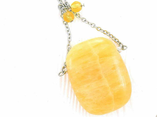30-inch necklace with large rectangular honey yellow calcite stone pendant, triangular layout, matching glass beads, stainless steel chain