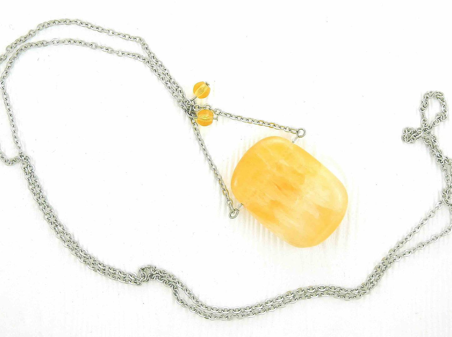 30-inch necklace with large rectangular honey yellow calcite stone pendant, triangular layout, matching glass beads, stainless steel chain