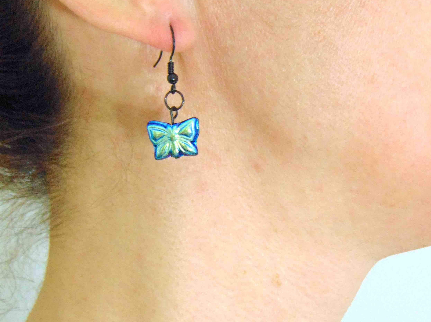 Short earrings with black and iridescent blue Czech glass butterflies, black metal hooks