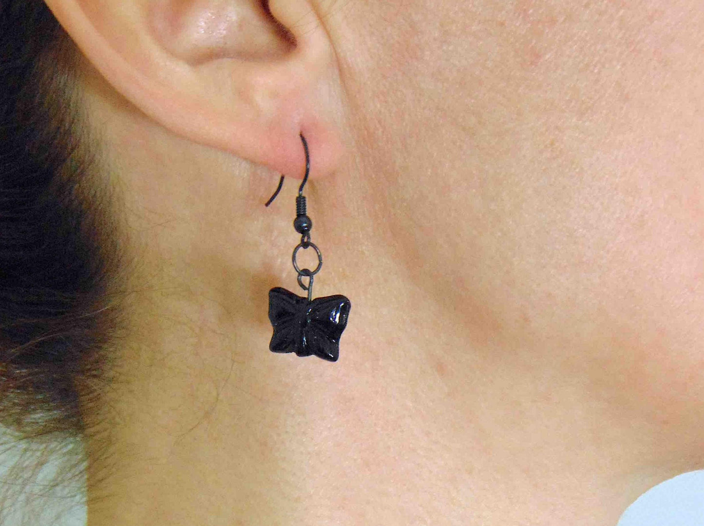 Short earrings with black and iridescent blue Czech glass butterflies, black metal hooks