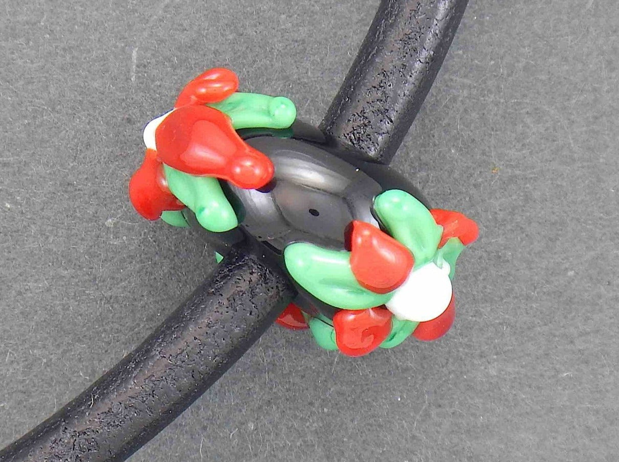 Choker necklace with black glass bead (Murano-style glass handmade in Montreal), 3-dimensional flowers in red-green-white, black leather cord, stainless steel clasp