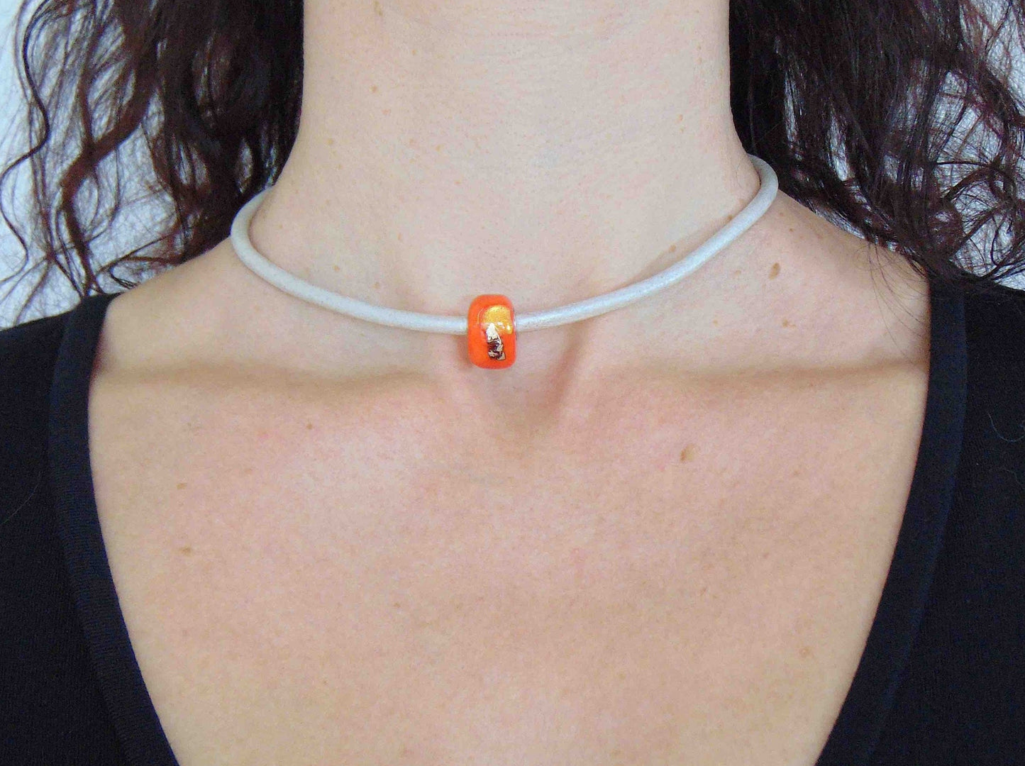 Choker necklace with bright orange cylinder glass bead (Murano-style glass handmade in Montreal), dichroic glass inclusions, pearl white leather cord, stainless steel clasp