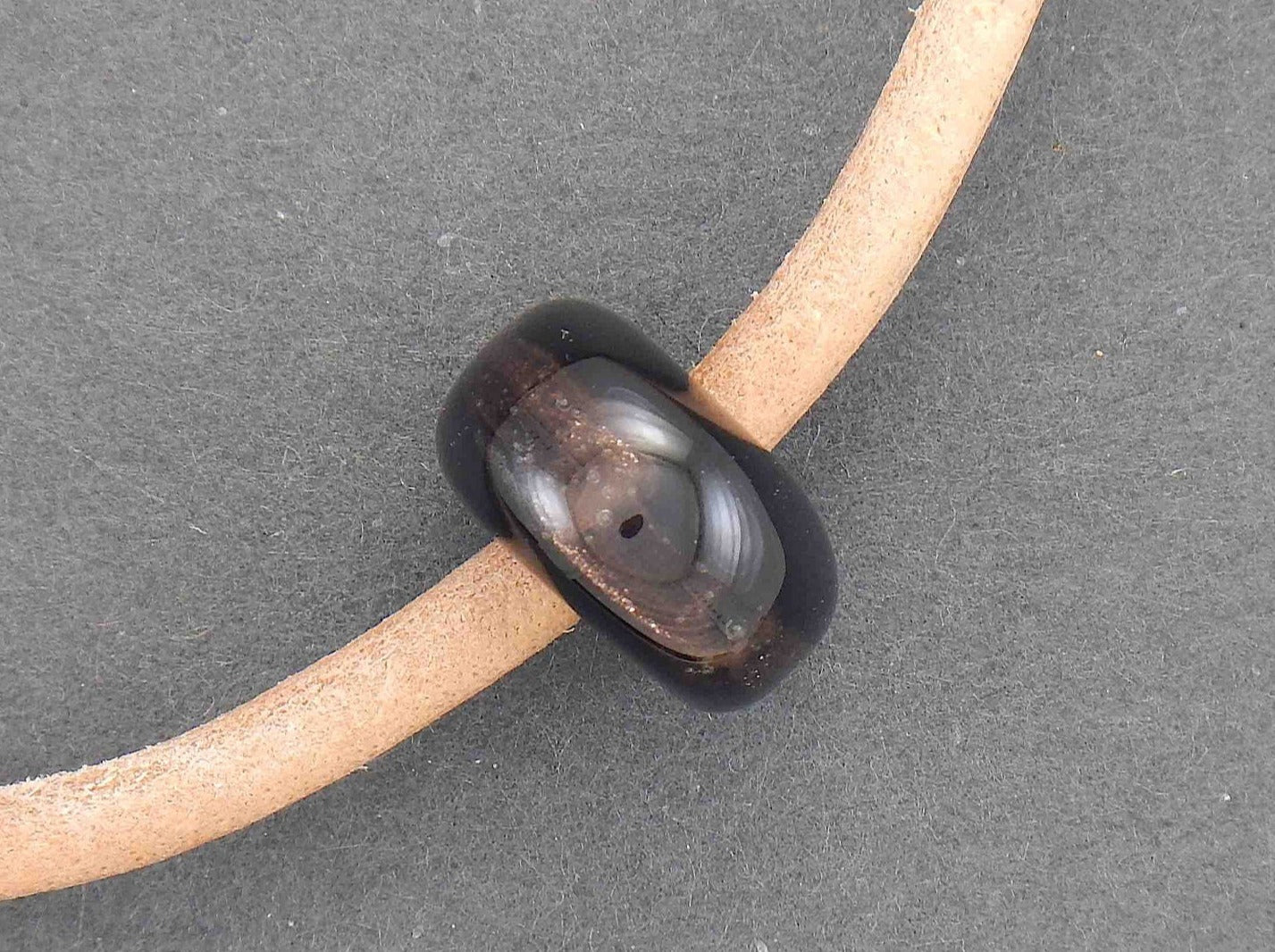 Choker necklace with black glass bead (Murano-style glass handmade in Montreal), bronze aventurine inclusions, rough natural leather cord, stainless steel clasp