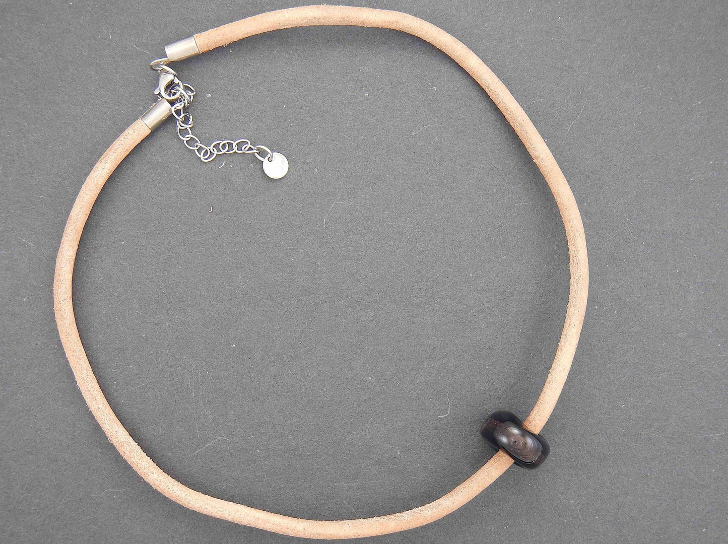 Choker necklace with black glass bead (Murano-style glass handmade in Montreal), bronze aventurine inclusions, rough natural leather cord, stainless steel clasp