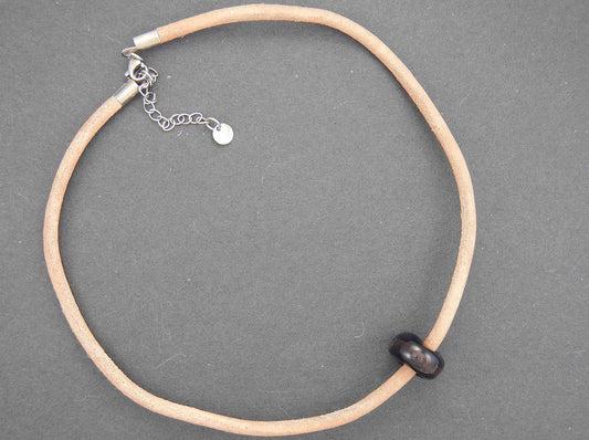 Choker necklace with black glass bead (Murano-style glass handmade in Montreal), bronze aventurine inclusions, rough natural leather cord, stainless steel clasp