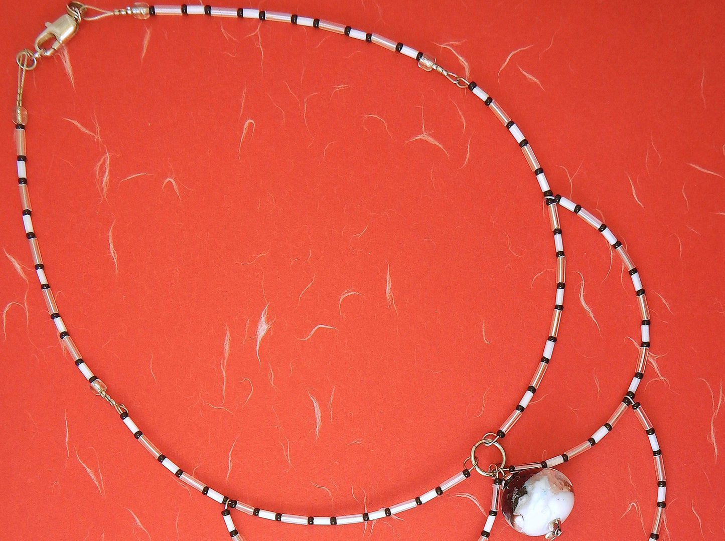 15-inch signature necklace with articulated black and white hoops and lampworked glass bead (Murano-style glass handmade in Montreal)