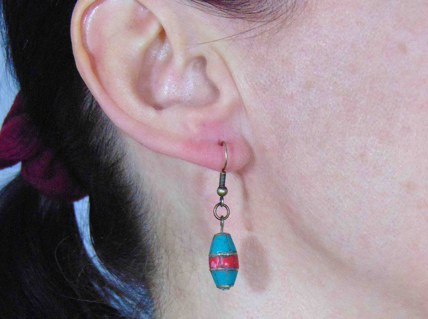 Short earrings with cylindrical Tibetan beads in turquoise and coral, brass hooks