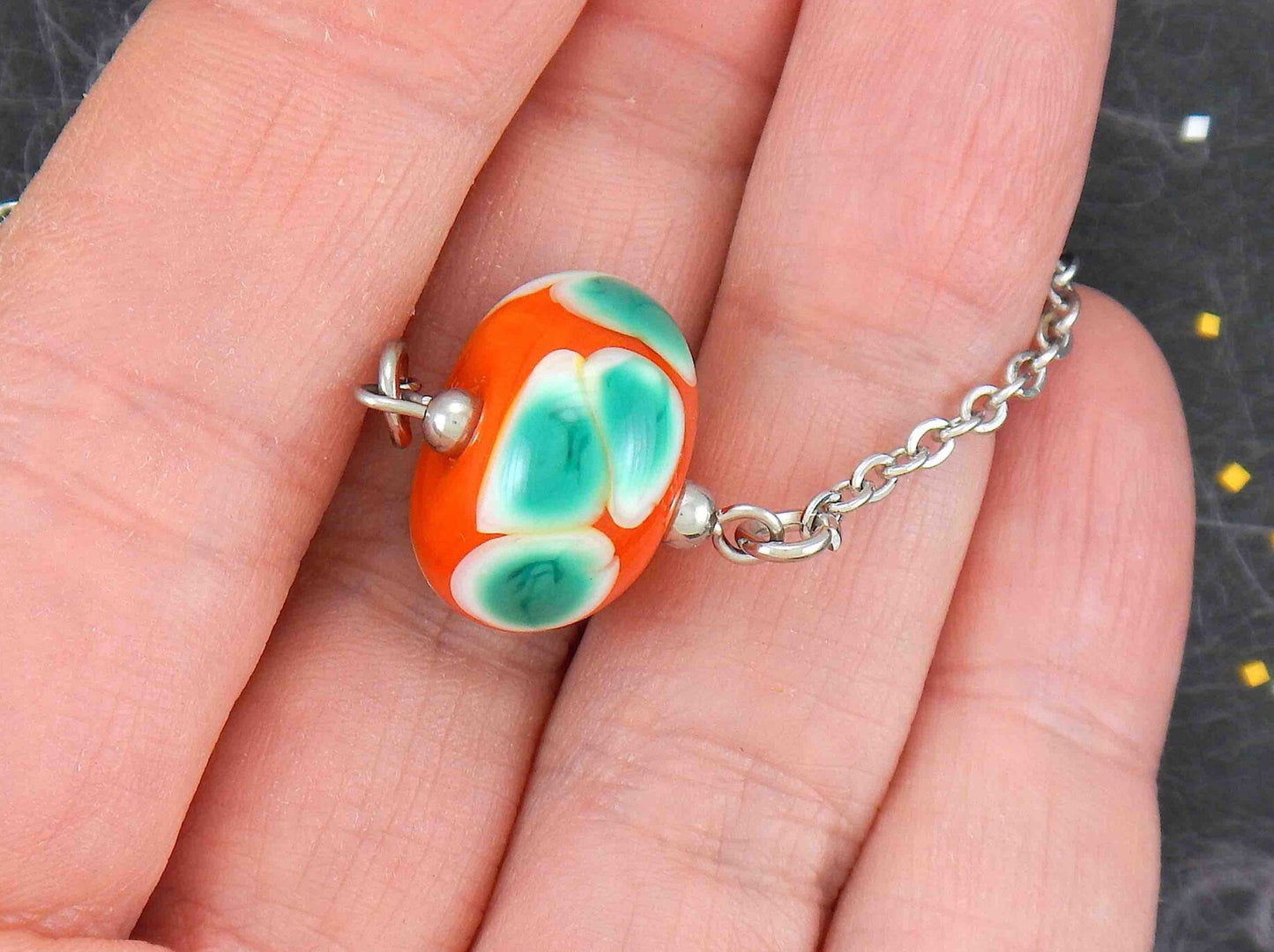 14-inch necklace with burnt orange ball, large white & green dots (Murano-style glass handmade in Montreal), stainless steel chain