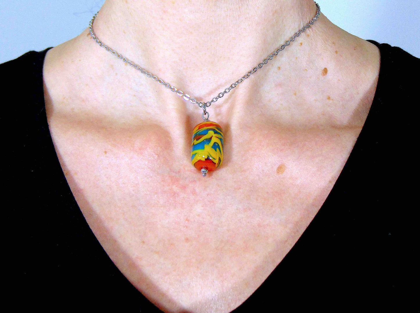 14-inch necklace with burnt orange glass cylinder marbled in turquoise & yellow (Murano-style glass handmade in Montreal), stainless steel chain