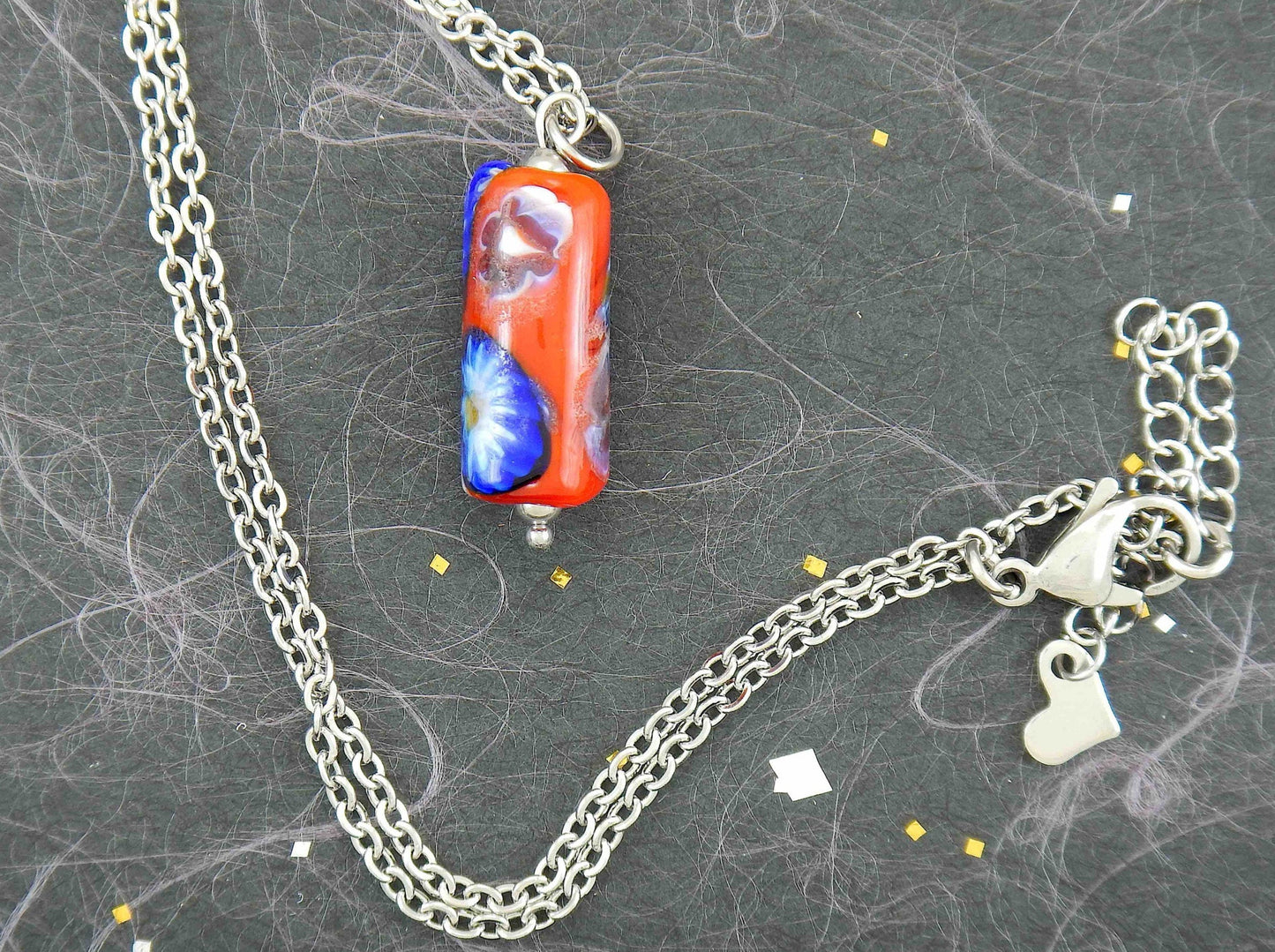 14-inch necklace with red glass cylinder and blue flower murines (Murano-style glass handmade in Montreal), stainless steel chain
