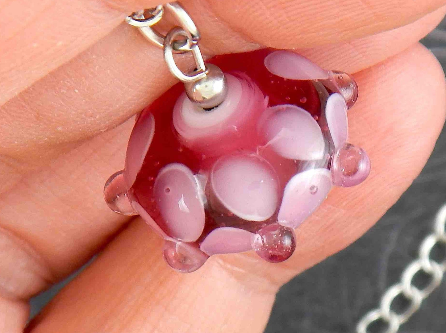 14-inch necklace with dark pink saucer-shaped Murano glass bead, 3-dimensional light pink and white dots, stainless steel chain