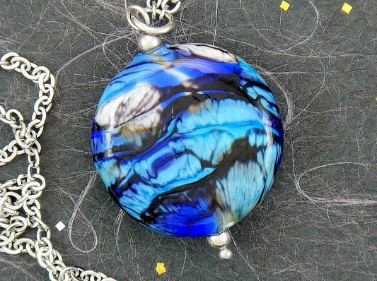 29-inch necklace with Murano glass round pendant marbled in dark blue, turquoise, black and white, stainless steel chain