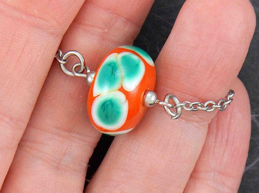 14-inch necklace with burnt orange ball, large white & green dots (Murano-style glass handmade in Montreal), stainless steel chain