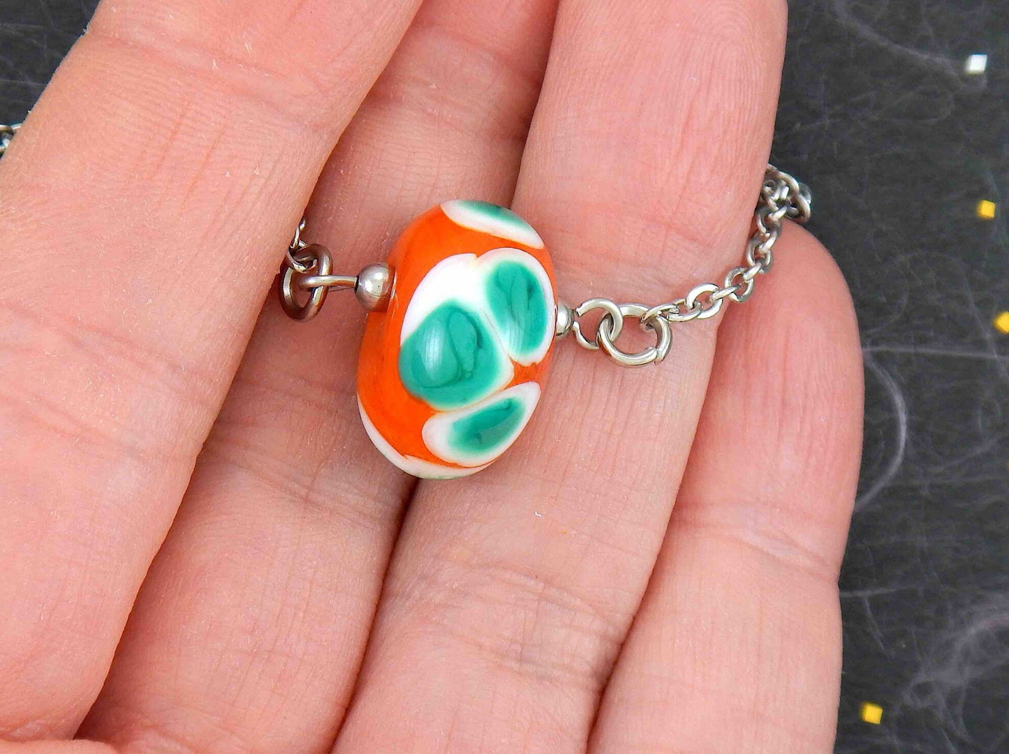 14-inch necklace with burnt orange ball, large white & green dots (Murano-style glass handmade in Montreal), stainless steel chain