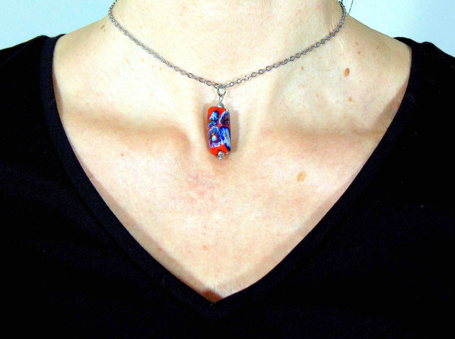14-inch necklace with red glass cylinder and blue flower murines (Murano-style glass handmade in Montreal), stainless steel chain