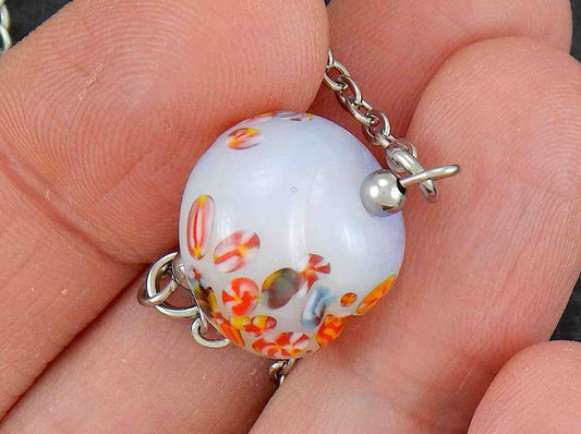 14-inch necklace with opalescent white vintage glass nugget, speckled with tiny multicoloured patterns, stainless steel chain
