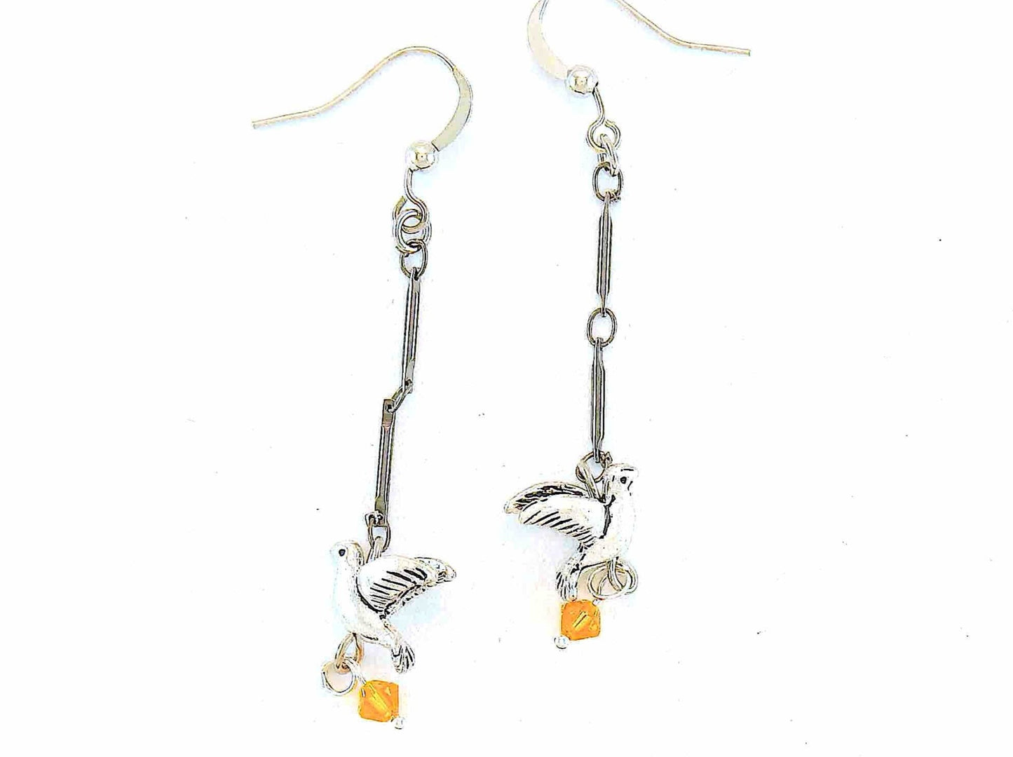Long earrings with small pewter flying birds and orange Swarovski crystals, metal hooks