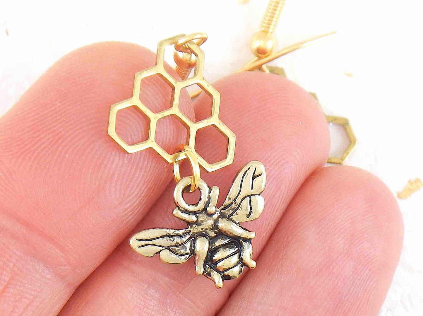 Long earrings with brass bees and honeycombs, gold-toned stainless steel hooks