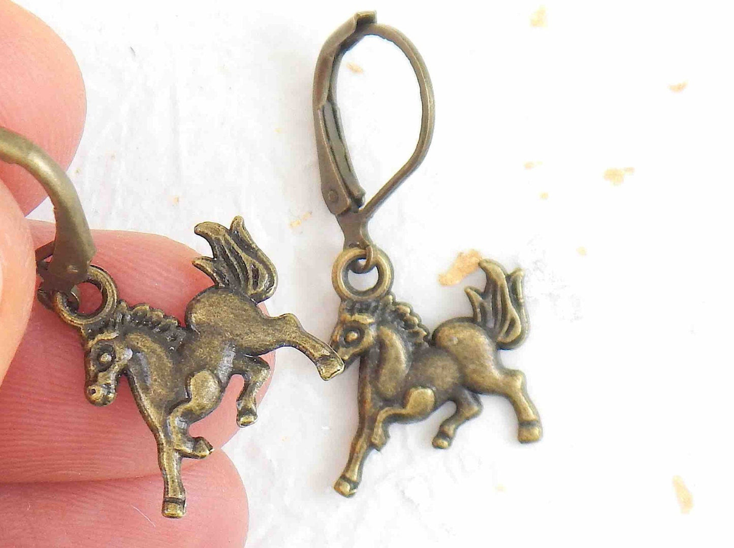 Short earrings with galloping horses, brass lever back hooks