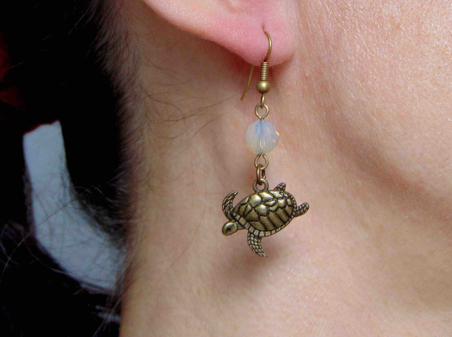 Long earrings with brass swimming turtles and Sand Opal Swarovski crystal balls, brass hooks