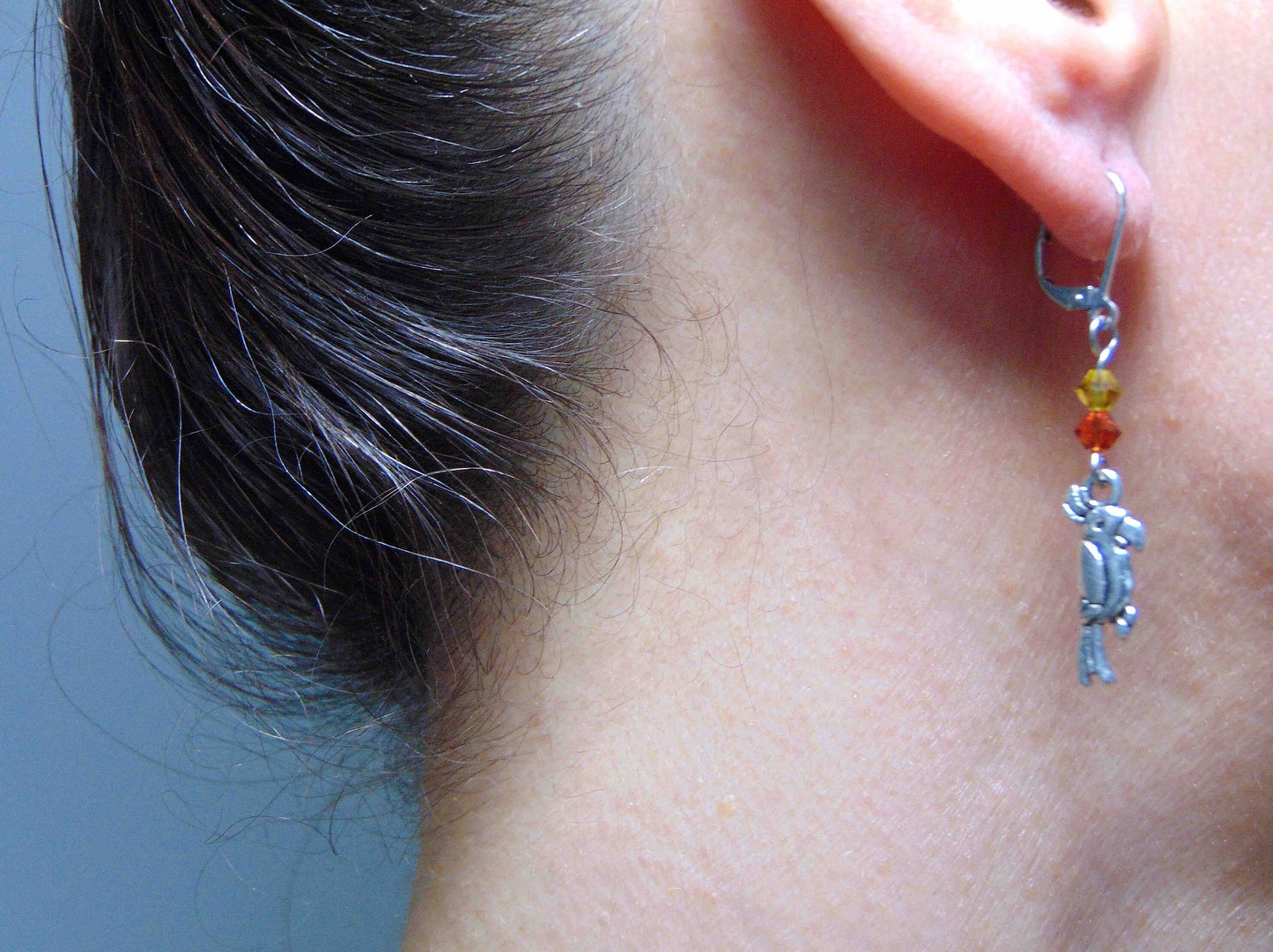 Long earrings with small pewter cockatoos (parrots) and Swarovski crystals, stainless steel lever back hooks