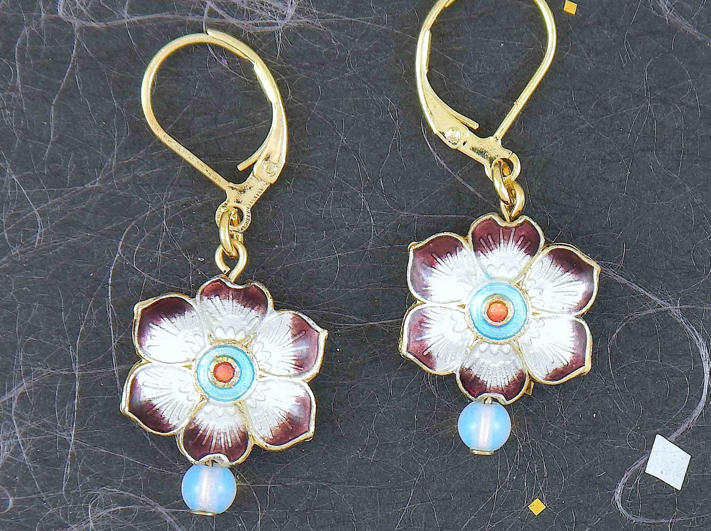 Short earrings with small enamelled flowers offered in 6 colours, synthetic moonstone (opalite), gold-toned stainless steel lever back hooks