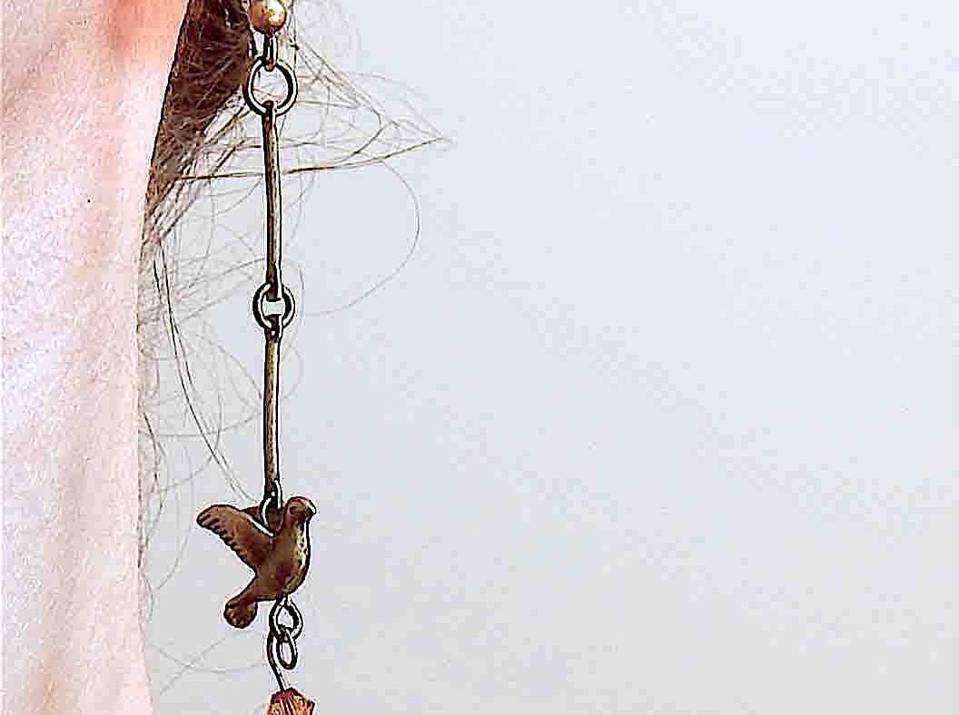 Long earrings with small brass flying birds and burnt orange Swarovski crystals, brass hooks
