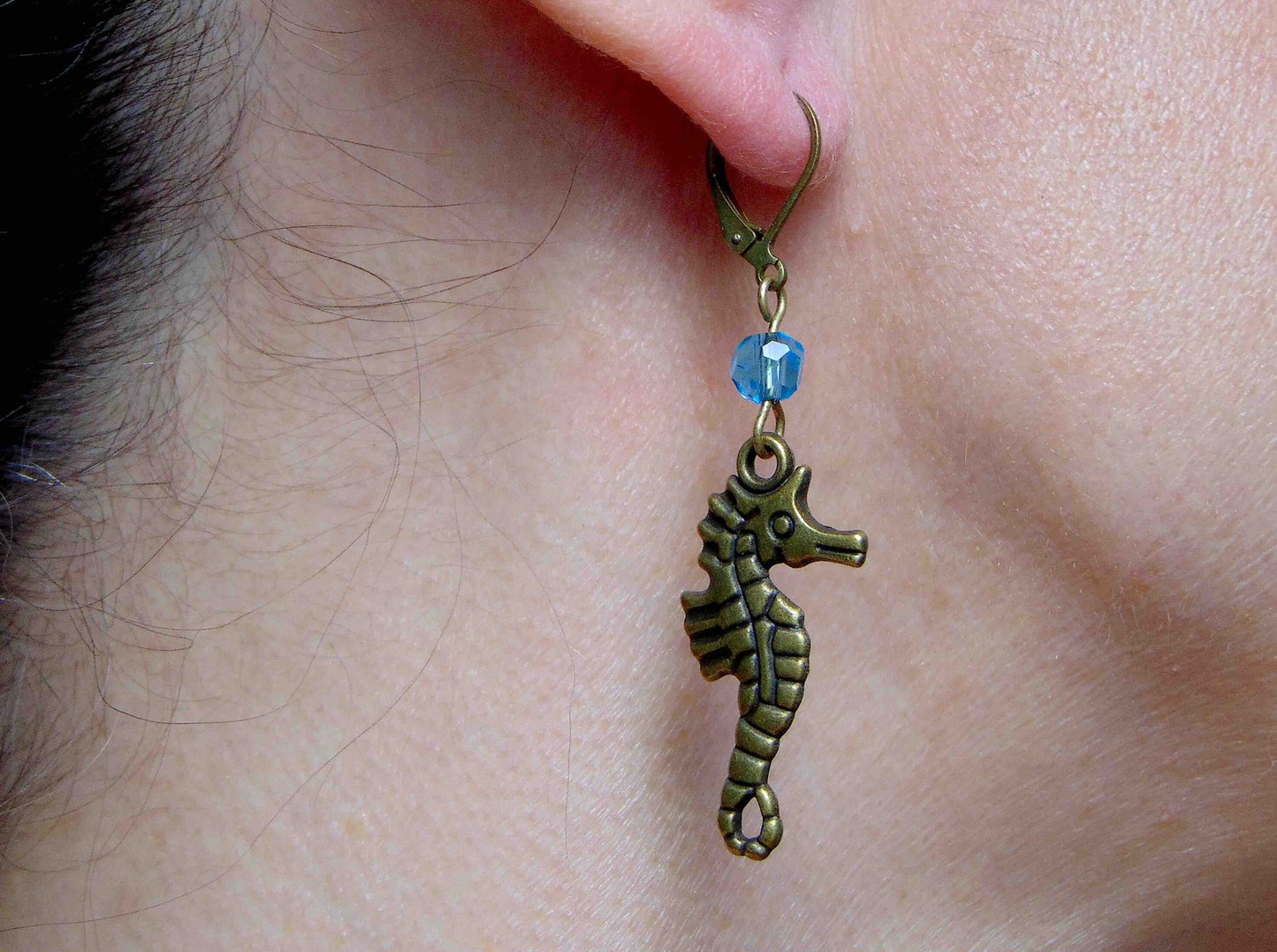 Long earrings with brass seahorses and turquoise Swarovski crystals, brass lever back hooks