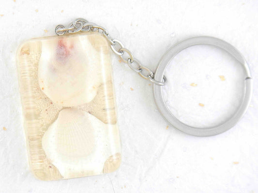 Keychain with handmade resin rectangle, white beach sand, white and pink shells, stainless steel chain