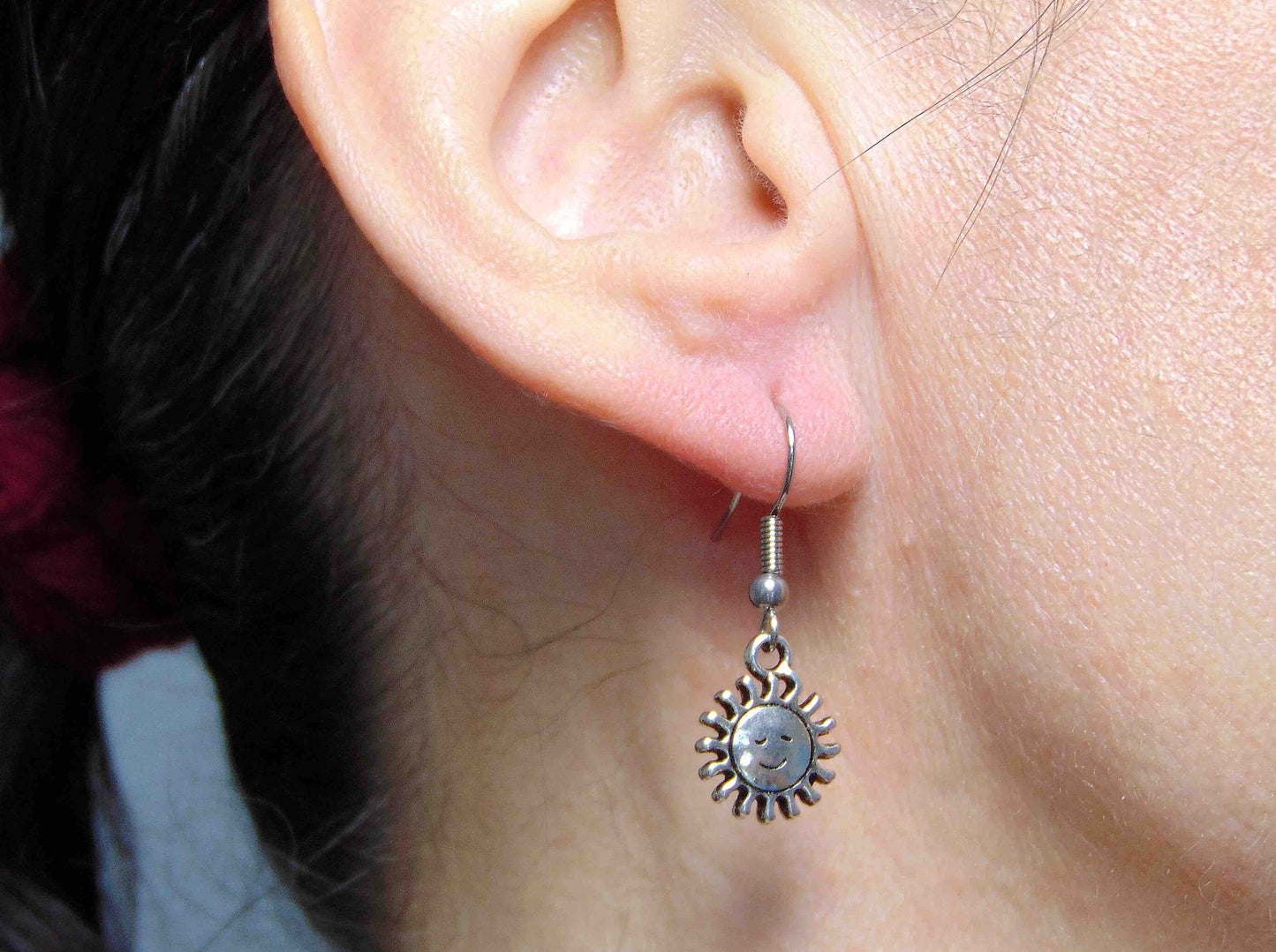 Short earrings with pewter smiling suns, stainless steel hooks