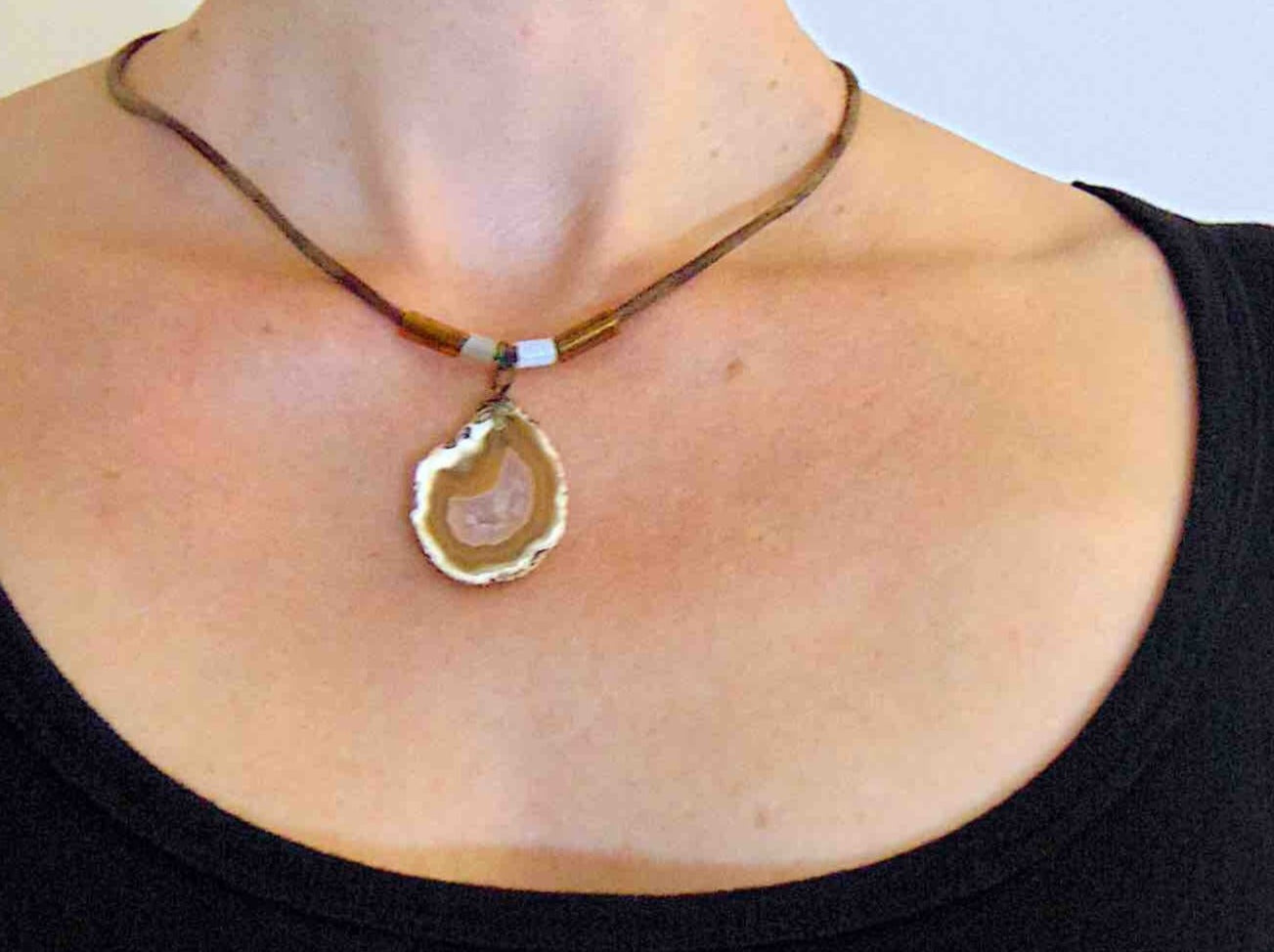 17-inch agate slice pendant in caramel and white on brown leather cord, antique glass cylinder beads, copper clasp