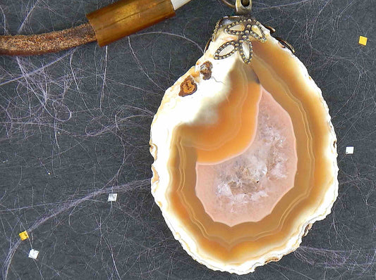 17-inch agate slice pendant in caramel and white on brown leather cord, antique glass cylinder beads, copper clasp
