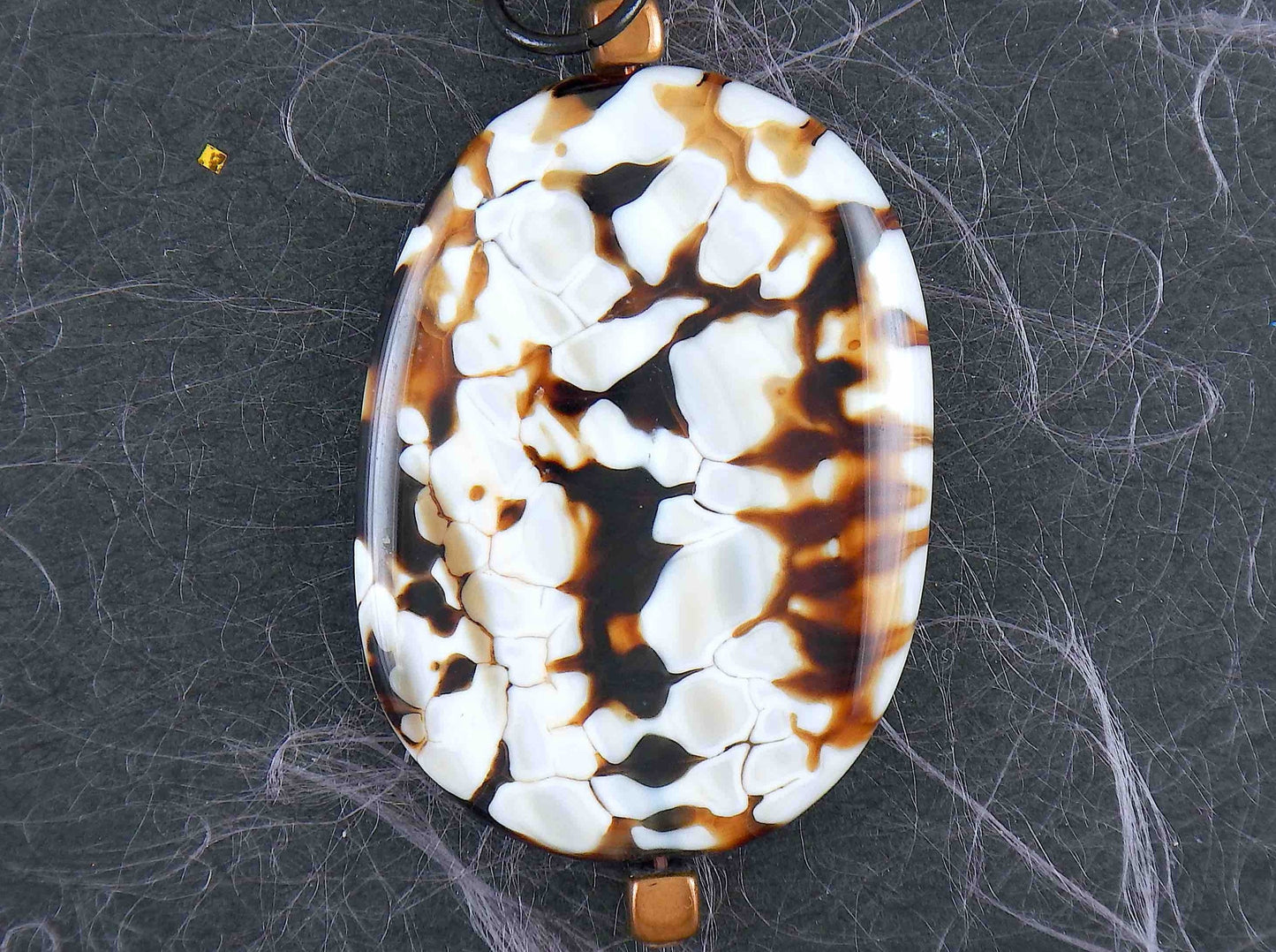 26-inch necklace with speckled black-brown-white jasper stone pendant, striped amber glass beads, black stainless steel chain