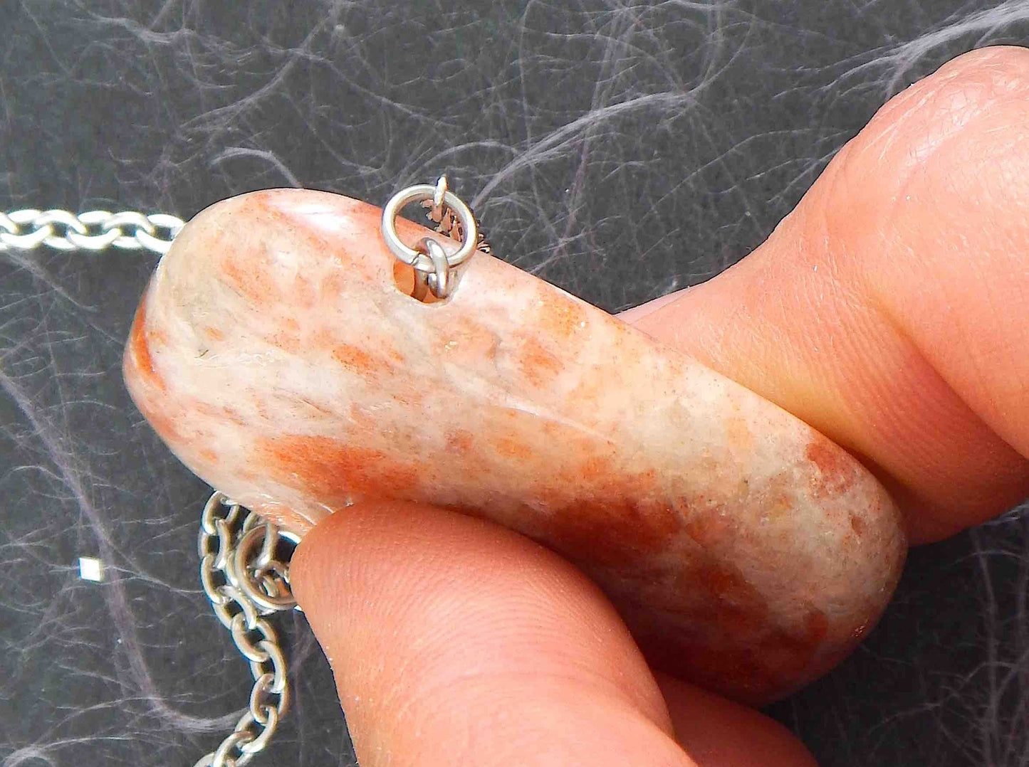 33-inch necklace with smooth rectangular white and rose gold sunstone pendant, stainless steel chain
