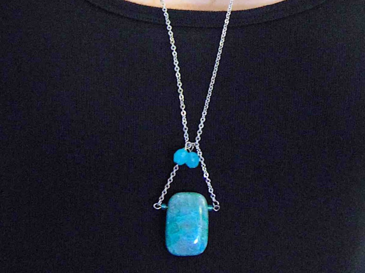 30-inch necklace with large rectangular blue-green chrysocolla stone pendant, triangular layout, matching glass beads, stainless steel chain