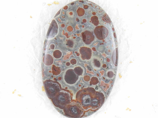 16-inch necklace with oval leopard jasper stone pendant, burgundy and chocolate brown dots on blue-grey background, stainless steel chain
