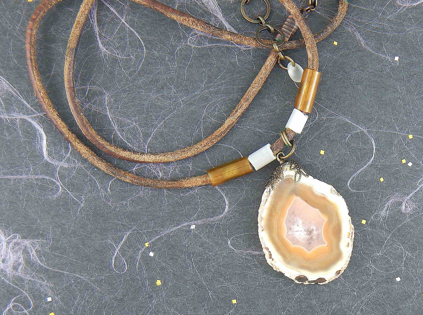 17-inch agate slice pendant in caramel and white on brown leather cord, antique glass cylinder beads, copper clasp