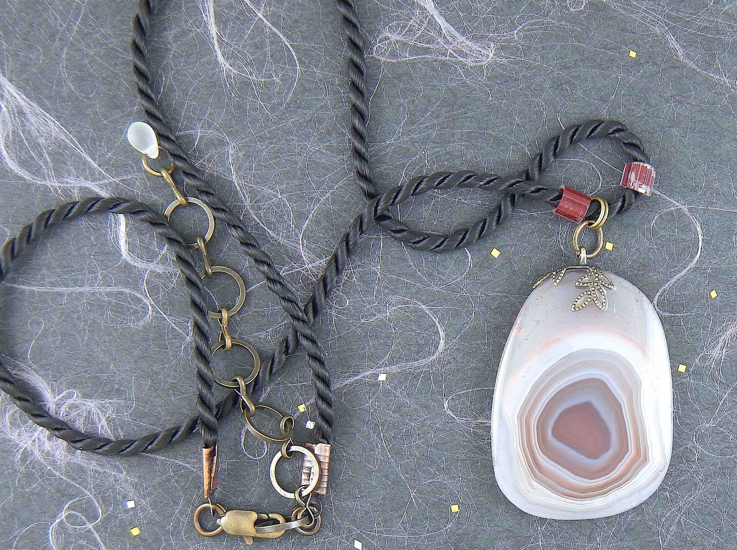 17-inch agate slice pendant in burgundy-white-gray on black satin cord, antique glass cylinder beads, copper clasp