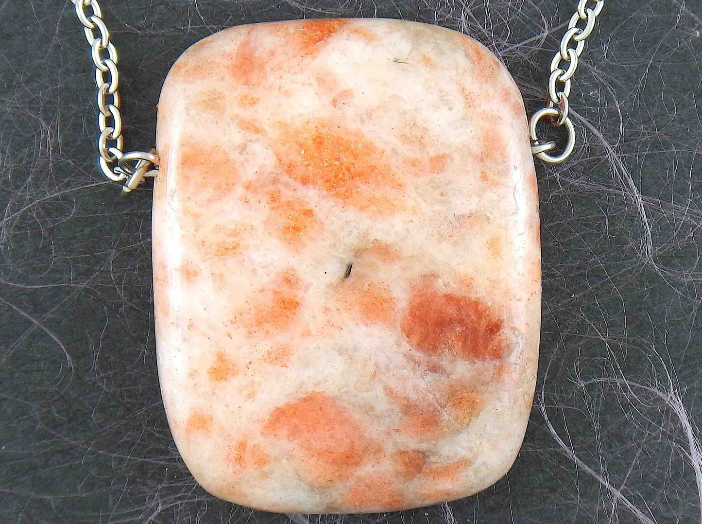 33-inch necklace with smooth rectangular white and rose gold sunstone pendant, stainless steel chain