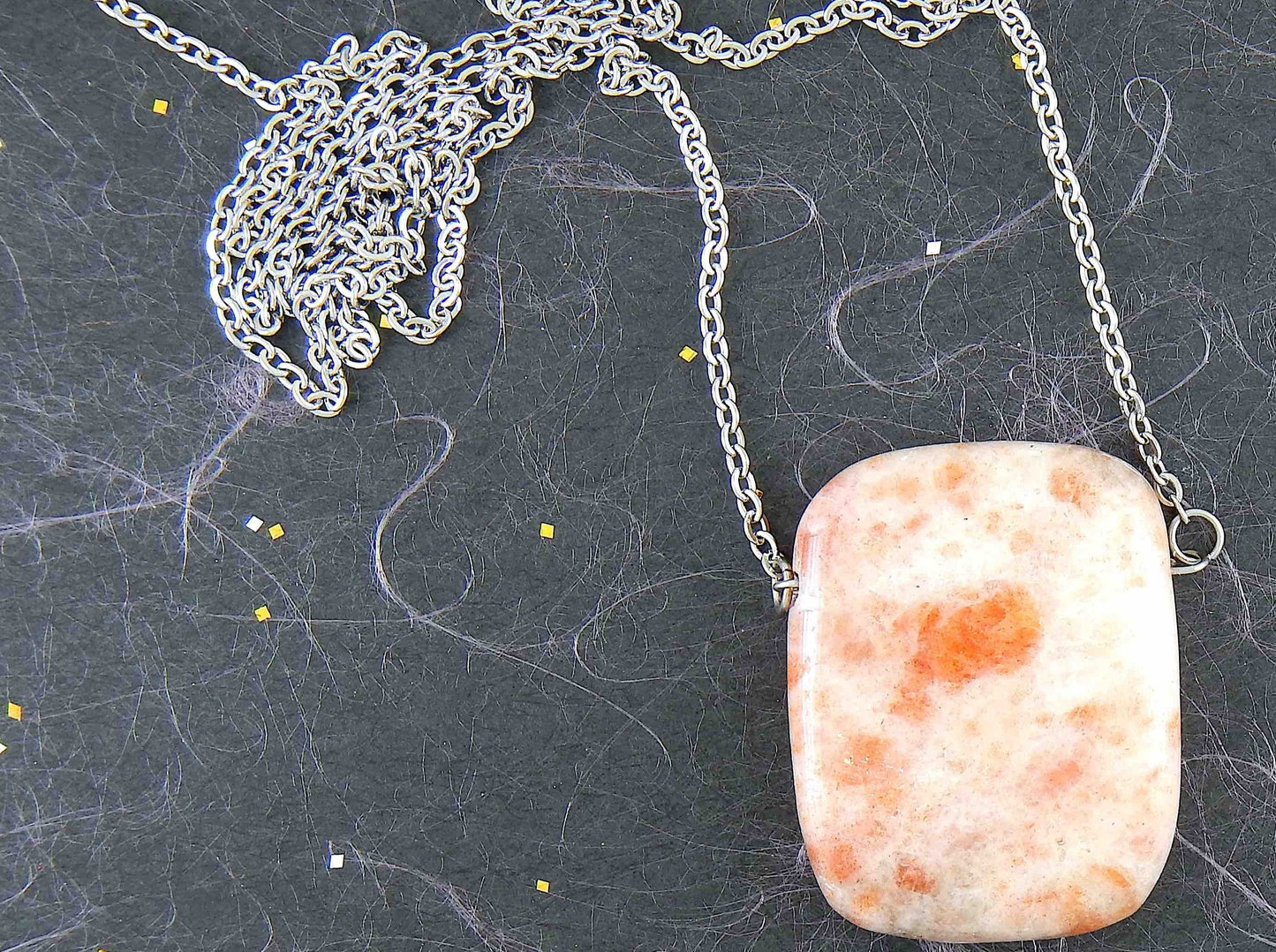 33-inch necklace with smooth rectangular white and rose gold sunstone pendant, stainless steel chain