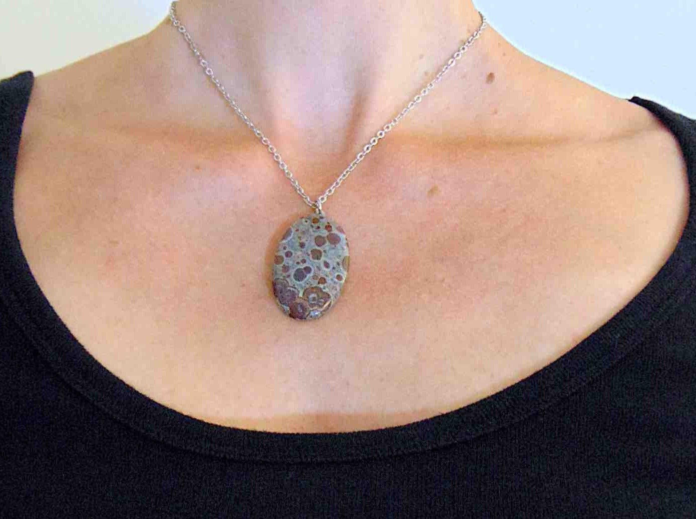 16-inch necklace with oval leopard jasper stone pendant, burgundy and chocolate brown dots on blue-grey background, stainless steel chain