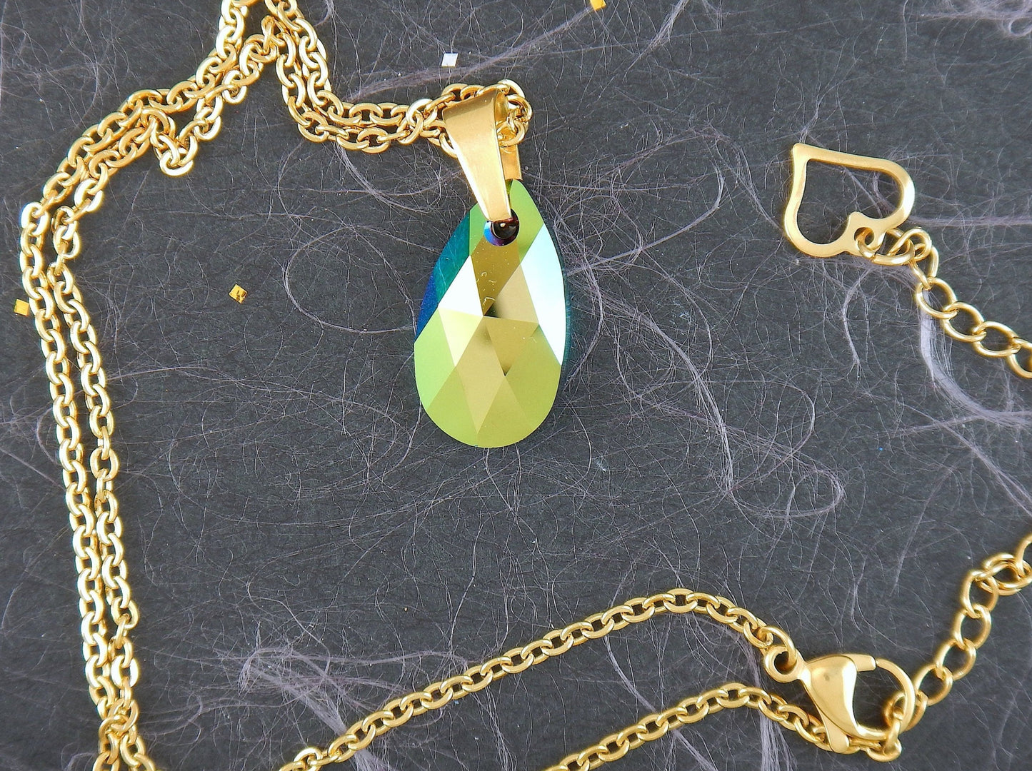 15-inch necklace with 20mm Swarovski crystal drop pendant, 1 side Scarabeus Green, 1 side Silver Gray, gold-toned stainless steel chain