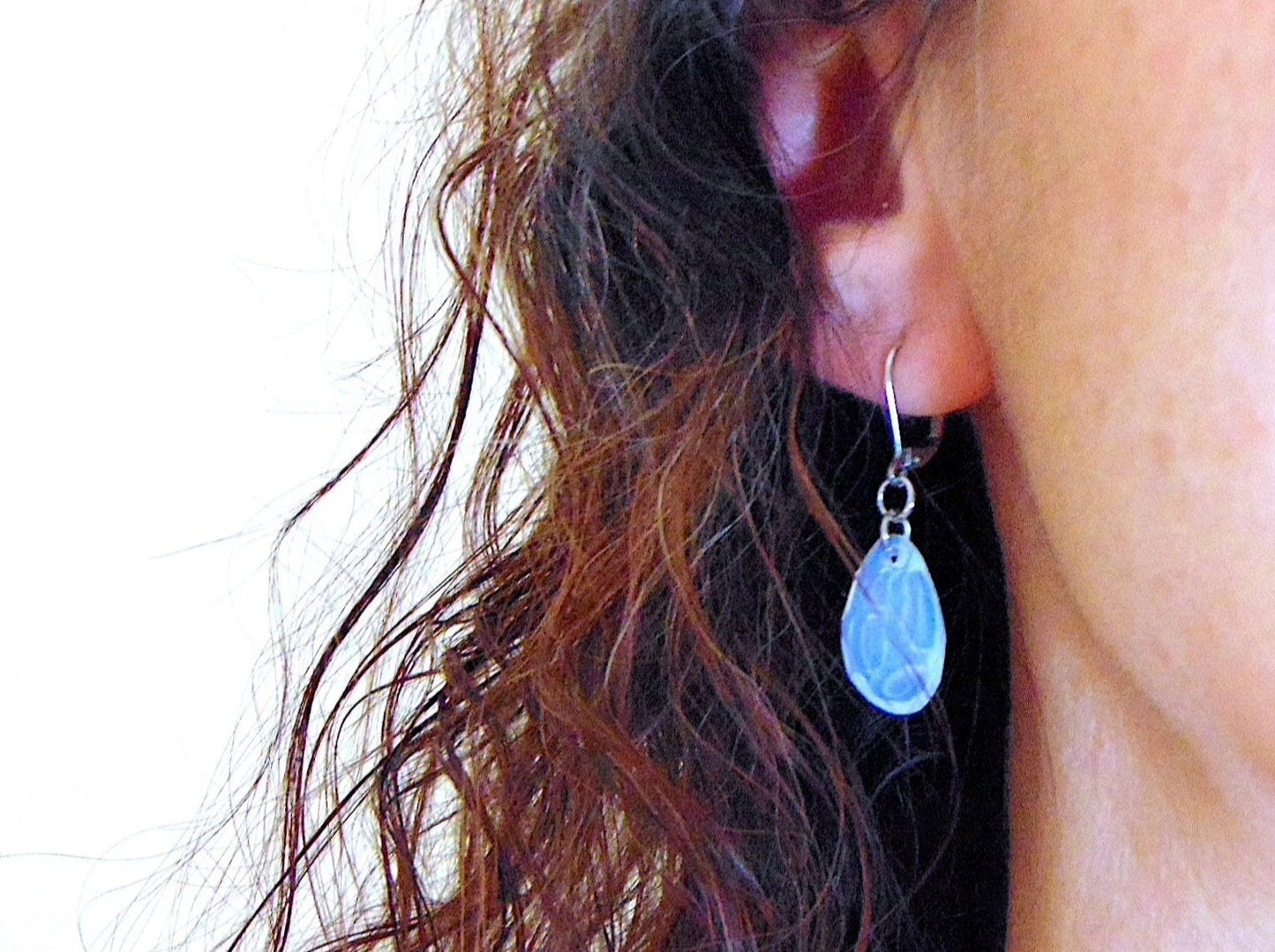 Short earrings with opalescent white Swarovski crystal Radiolarian drops, 3-dimensional crater pattern, stainless steel lever back hooks