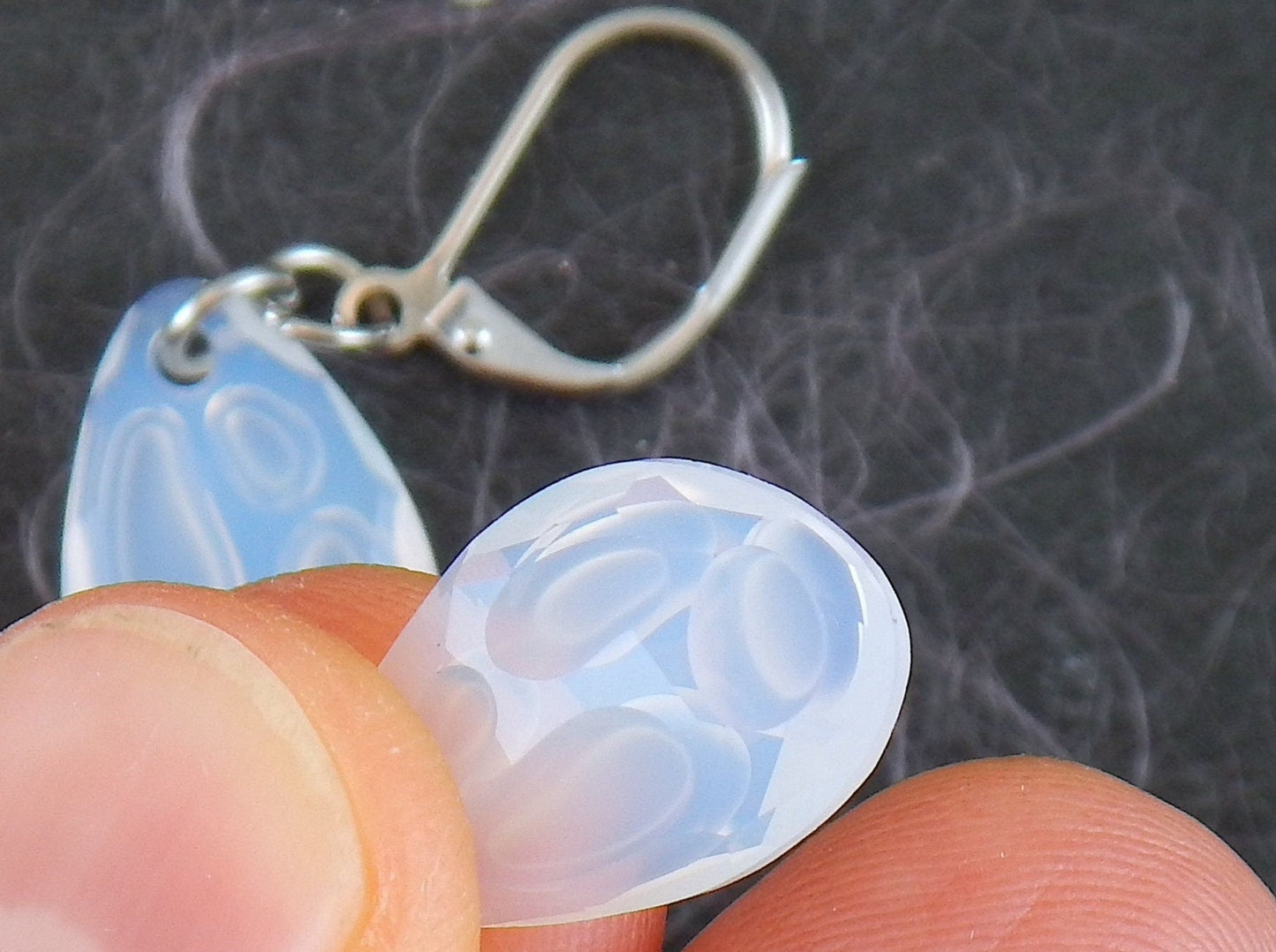 Short earrings with opalescent white Swarovski crystal Radiolarian drops, 3-dimensional crater pattern, stainless steel lever back hooks